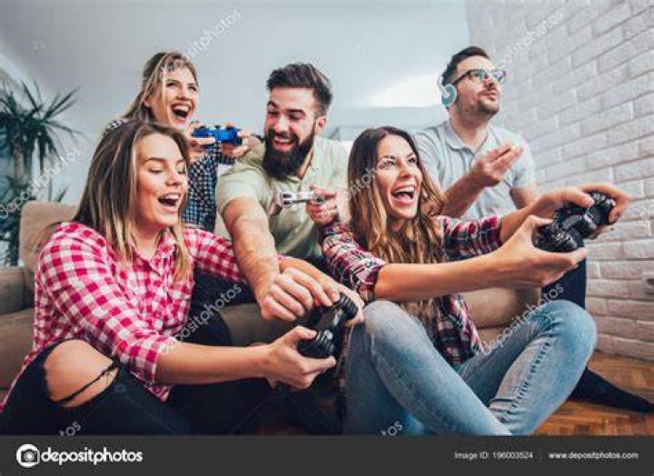 A group of friends playing a board game together.
