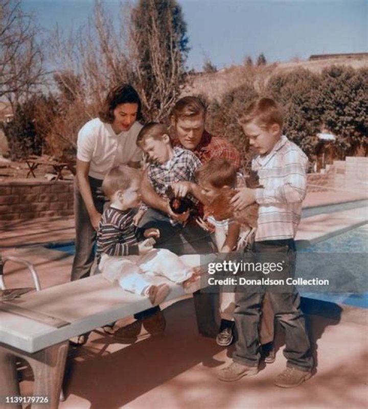 Actor Chuck Connors at home with his wife Elizabeth Jane Riddell