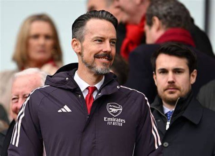 Arsenal chief Josh Kroenke watches on from stands with mystery woman as he rules out selling