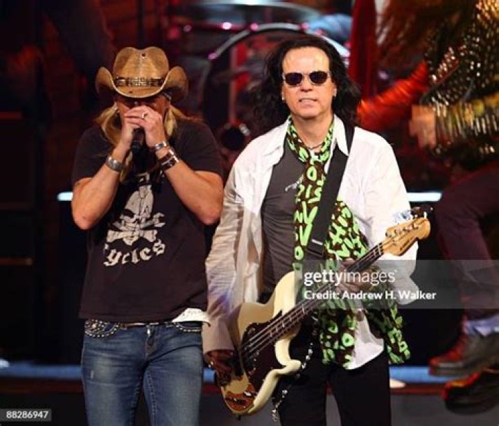 Bret Michaels and Bobby Dall from Poison with their respective ladies