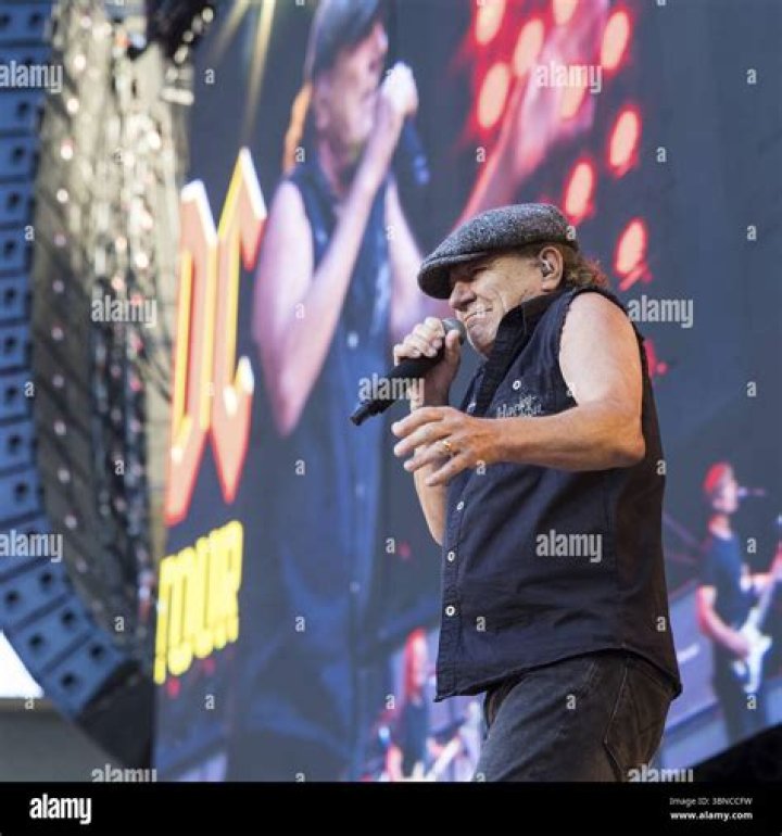 Brian Johnson lead singer of the rock group AC DC with his daughters