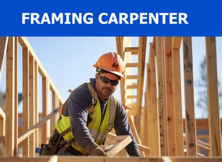 Framing carpenter works on new homes