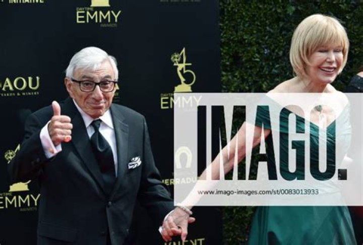 Jamie Farr (L) and his wife Joy Ann Richards arrive on the red carpet