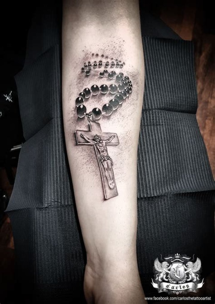 jesus, cross, rosary, religious tattoo, forearm tattoo, black and grey
