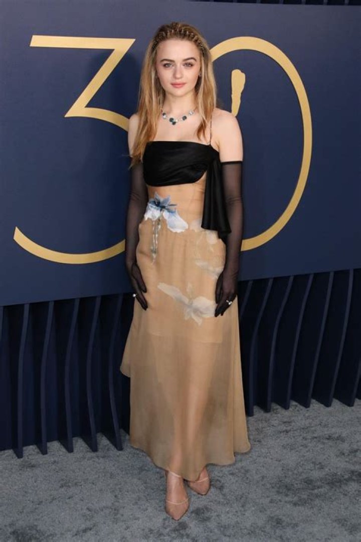 Joey King looks smart as she rocks a denim dress while enjoying