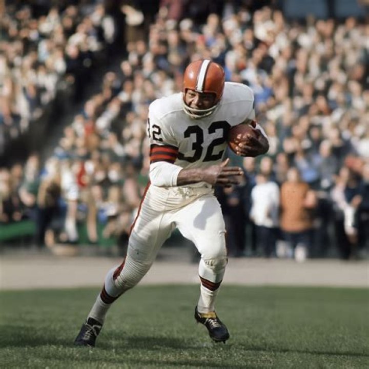 (Original Caption) Jim Brown, fullback of Cleveland Browns, sits in front of his home with