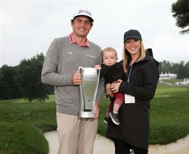 PGA TOUR pro Keegan Bradley holds the BMW Championship trophy alongside