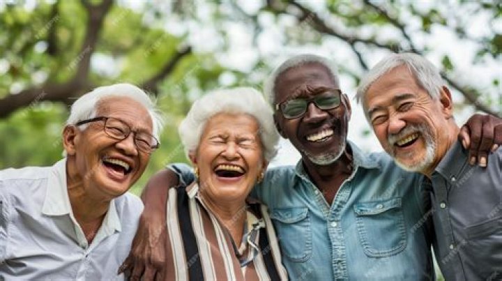 Three people smiling at camera