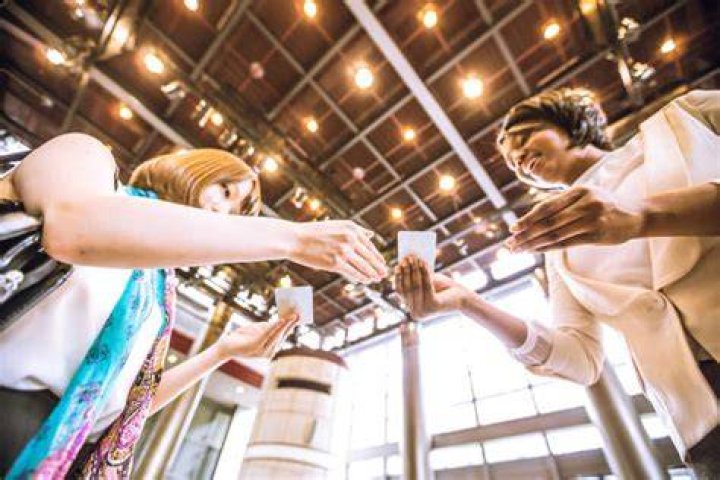 Young Female Entrepreneurs Exchanging Business Cards
